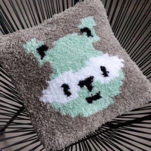 Coussin point noué raton laveur
